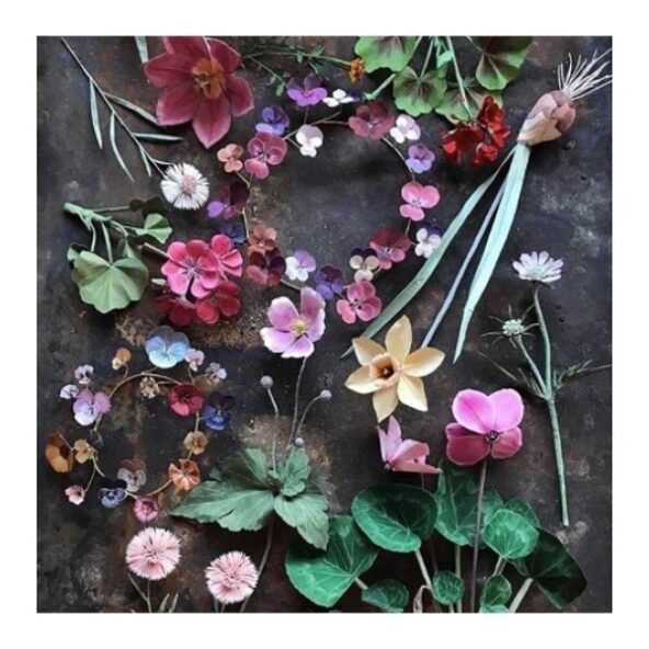 Handmade paper flowers by woodlucker. This artist’s current work is