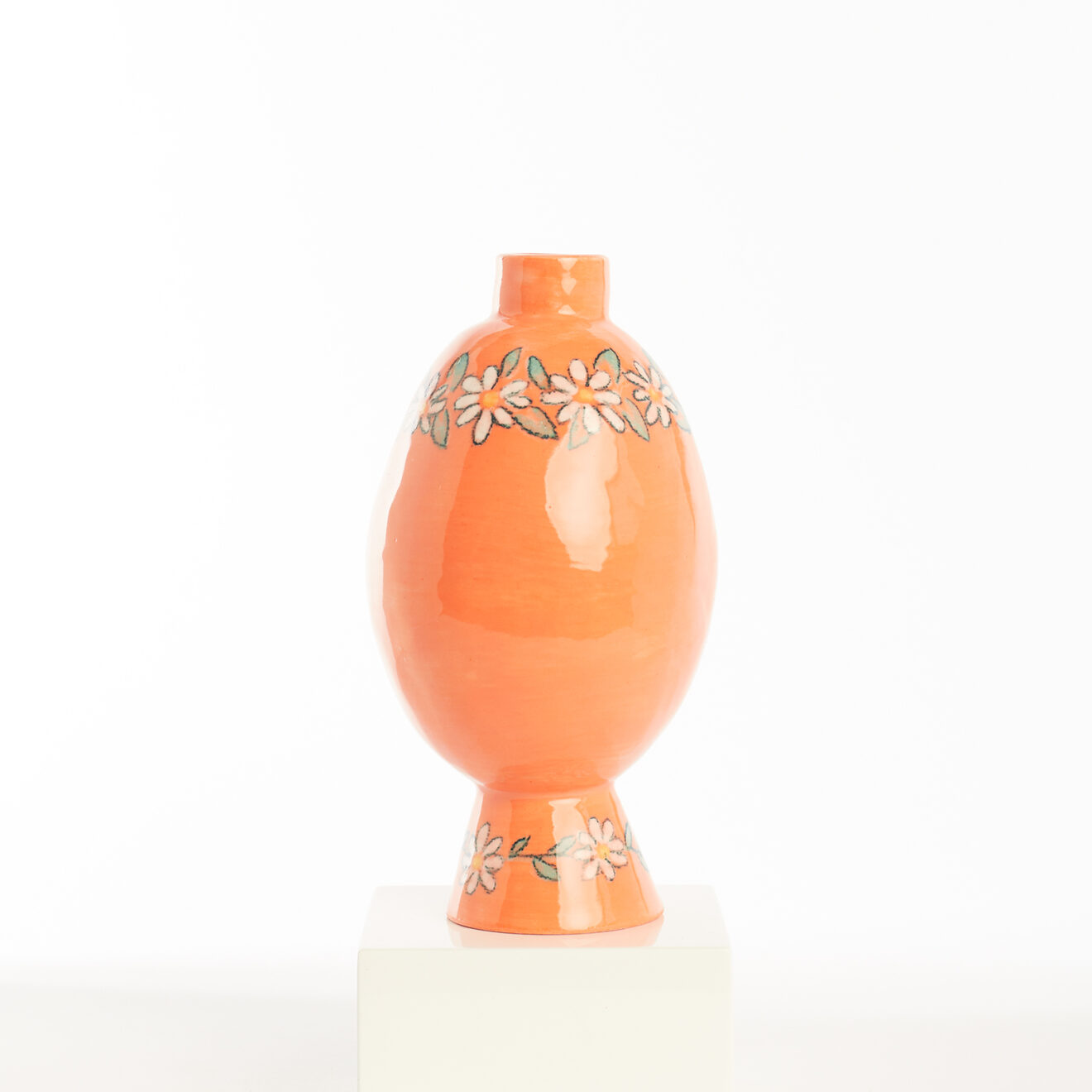 Mini orange pot with white flowers