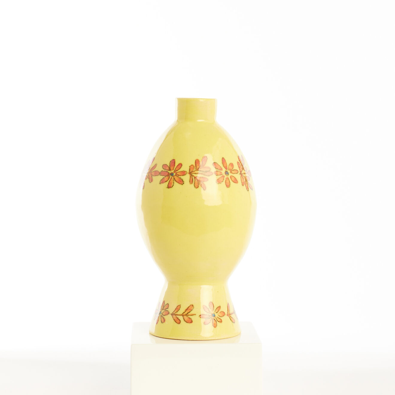mini yellow pot with orange flowers Mini yellow pot with orange flowers