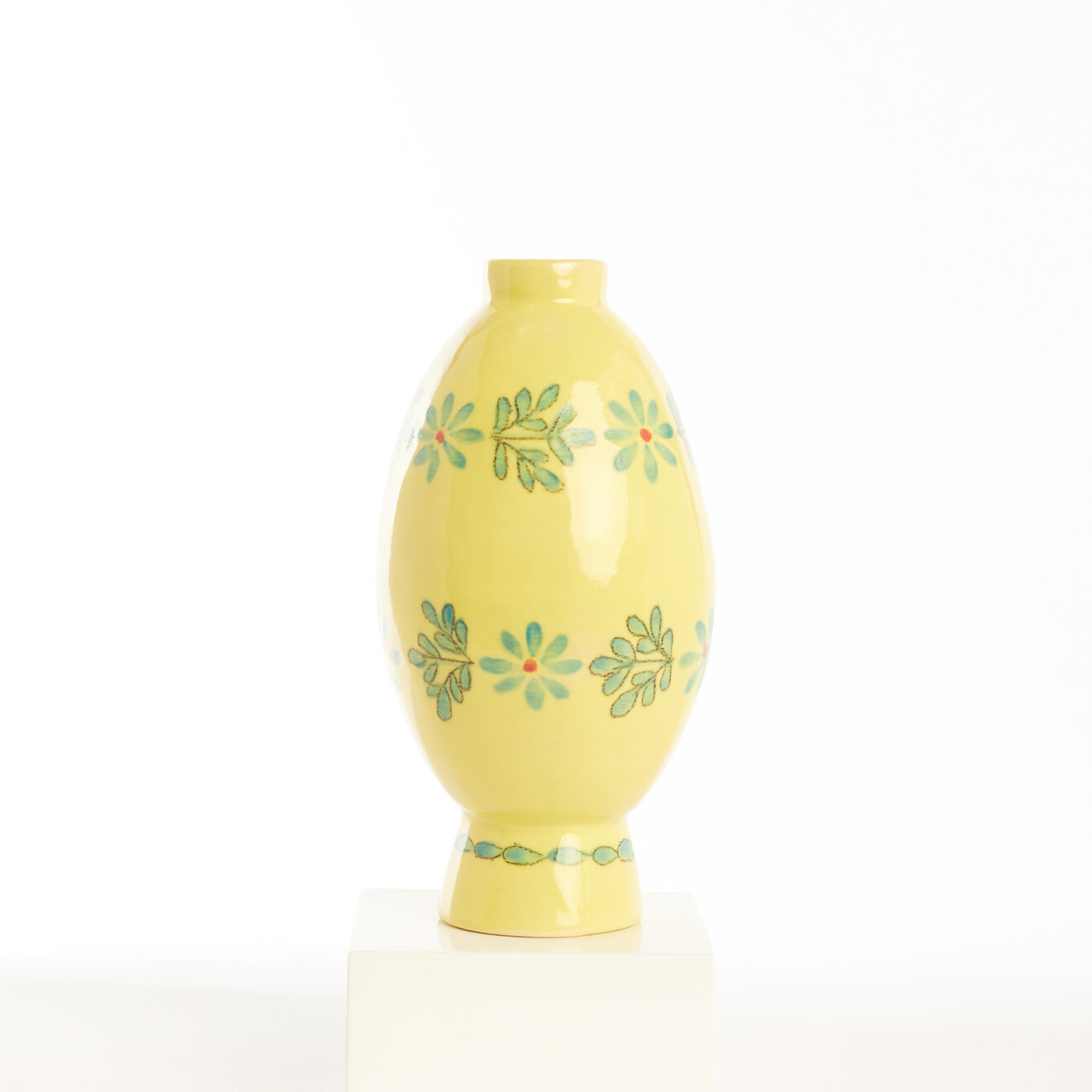 Mini yellow pot with blue flowers